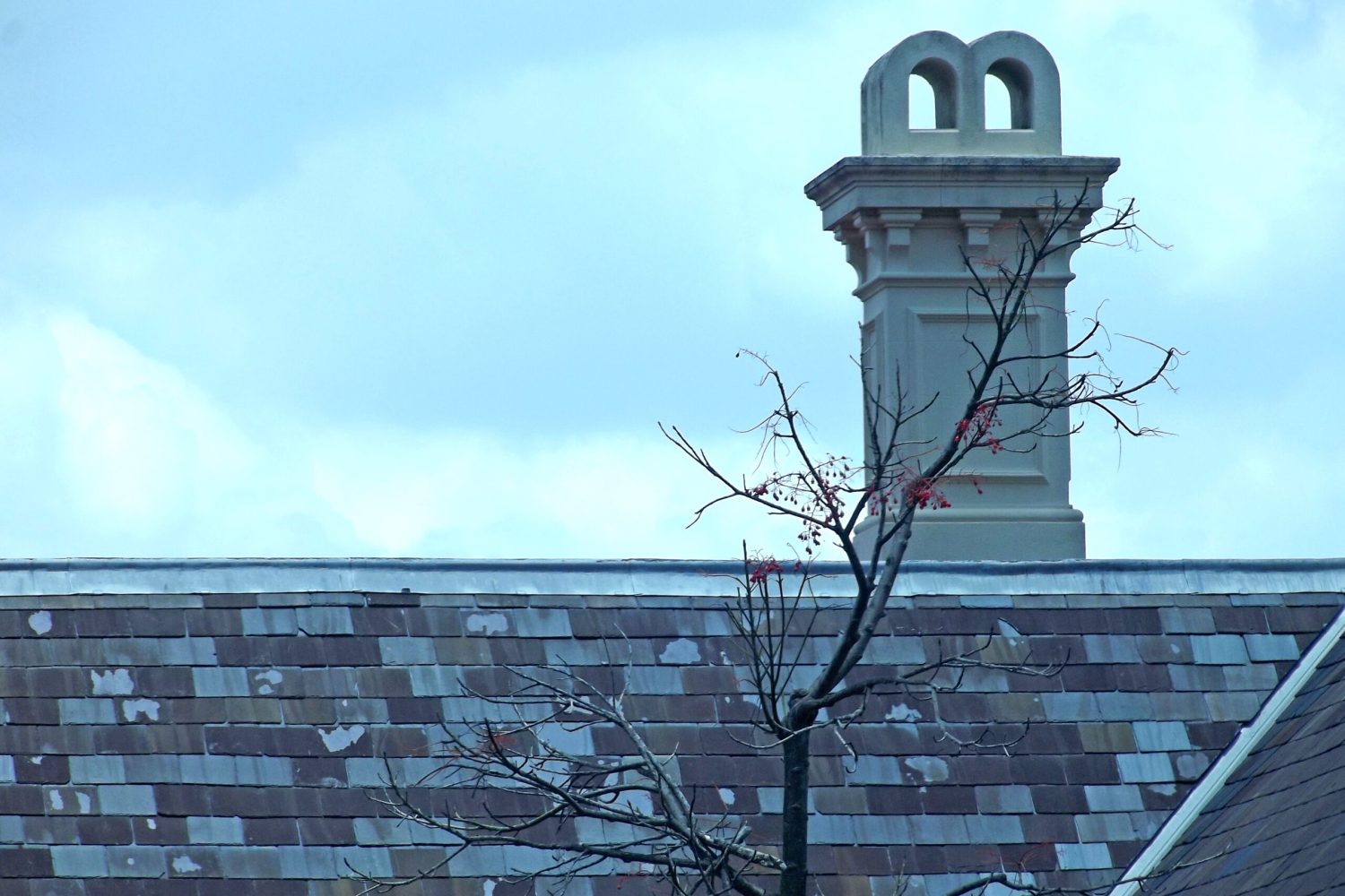 chimney-on-an-old-tiled-roof-2023-11-27-05-10-45-utc